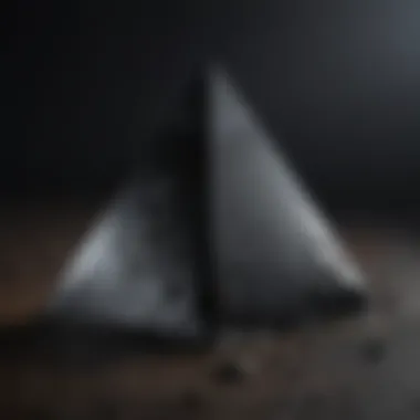 Striking black obsidian pyramid showcasing its lustrous surface