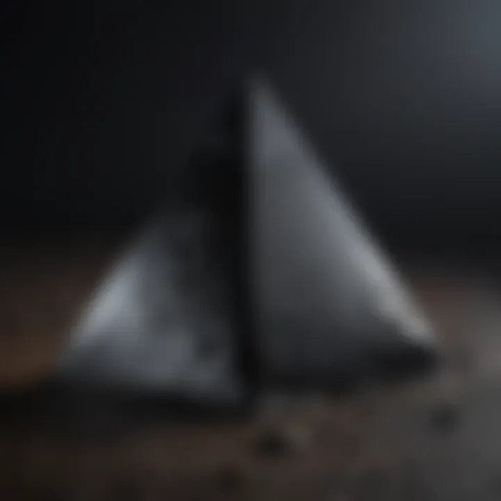 Striking black obsidian pyramid showcasing its lustrous surface
