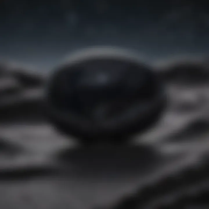 Black obsidian worry stone positioned on a reflective surface under a blanket of starlit sky