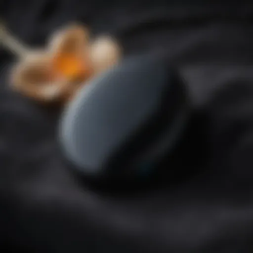 Dark and mysterious black obsidian worry stone resting on a bed of soft velvet