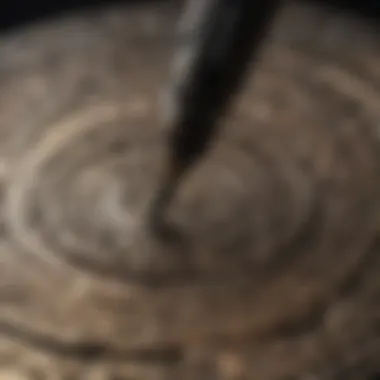 Dremel tool with cutting attachment creating intricate design