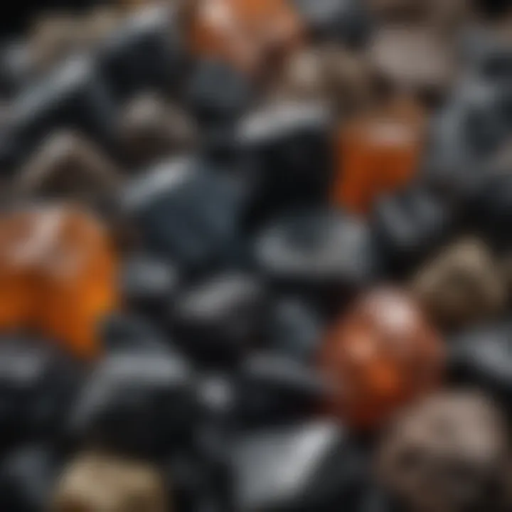 A collection display of various types of raw obsidian, emphasizing diversity