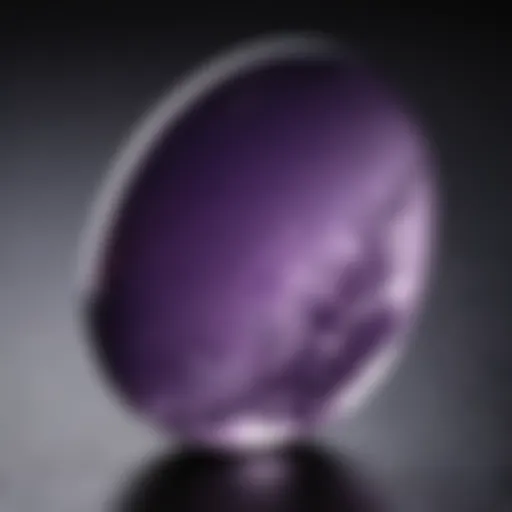 Close-up of a polished amethyst worry stone highlighting its smooth texture and rich purple hue