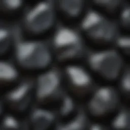 A close-up view of polished shungite stones displaying their unique texture.
