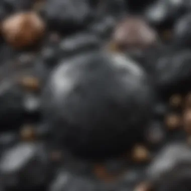 An artistic display of black minerals used in various industrial applications