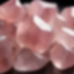 Close-up view of polished tumbled rose quartz stones showcasing their unique pink hues and translucence