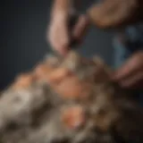 An intricate geological specimen being delicately repaired with adhesive
