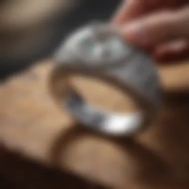 Master jeweler crafting intricate silver ring