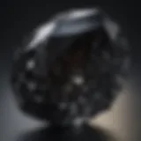 A close-up view of a lustrous black crystal showcasing its intricate facets and natural shine.
