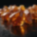 Glistening pieces of amber displayed on a dark background