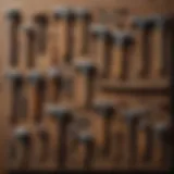 Different types of rock-breaking hammers displayed on a wooden surface