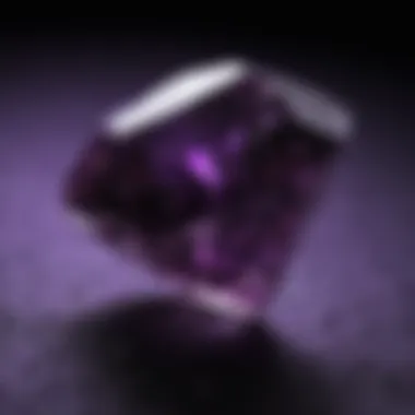 Close-up of a diamond exhibiting purple fluorescence under black light