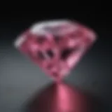 Close-up view of a diamond exhibiting pink luminescence under black light