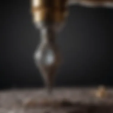 Jewelry Making with a Diamond Drill Bit An artist using a diamond drill bit on a piece of jewelry