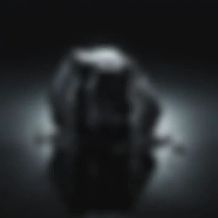 Detailed image of obsidian reflecting light, highlighting its glassy surface.