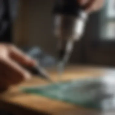 Craftsman using Dremel bit on glass