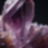 Close-up view of a raw amethyst crystal showcasing its natural facets and rich purple hue