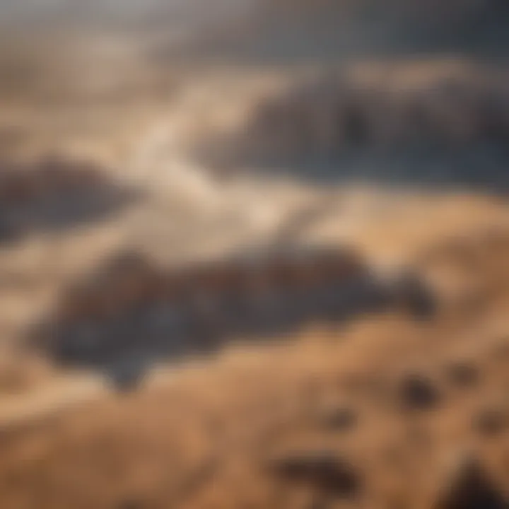 Aerial view of a desert landscape highlighting areas where caliche formations are prevalent.