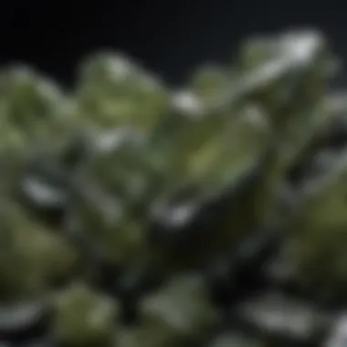 An overview of moldavite pieces arranged on a dark background to highlight their natural beauty