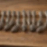 A variety of wood carving Dremel bits displayed on a wooden surface